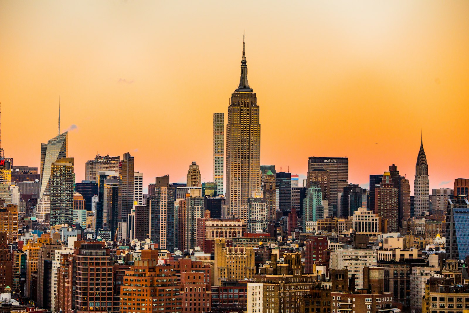 Manhattan skyline at golden hour with the Empire State Building and Chrysler Building